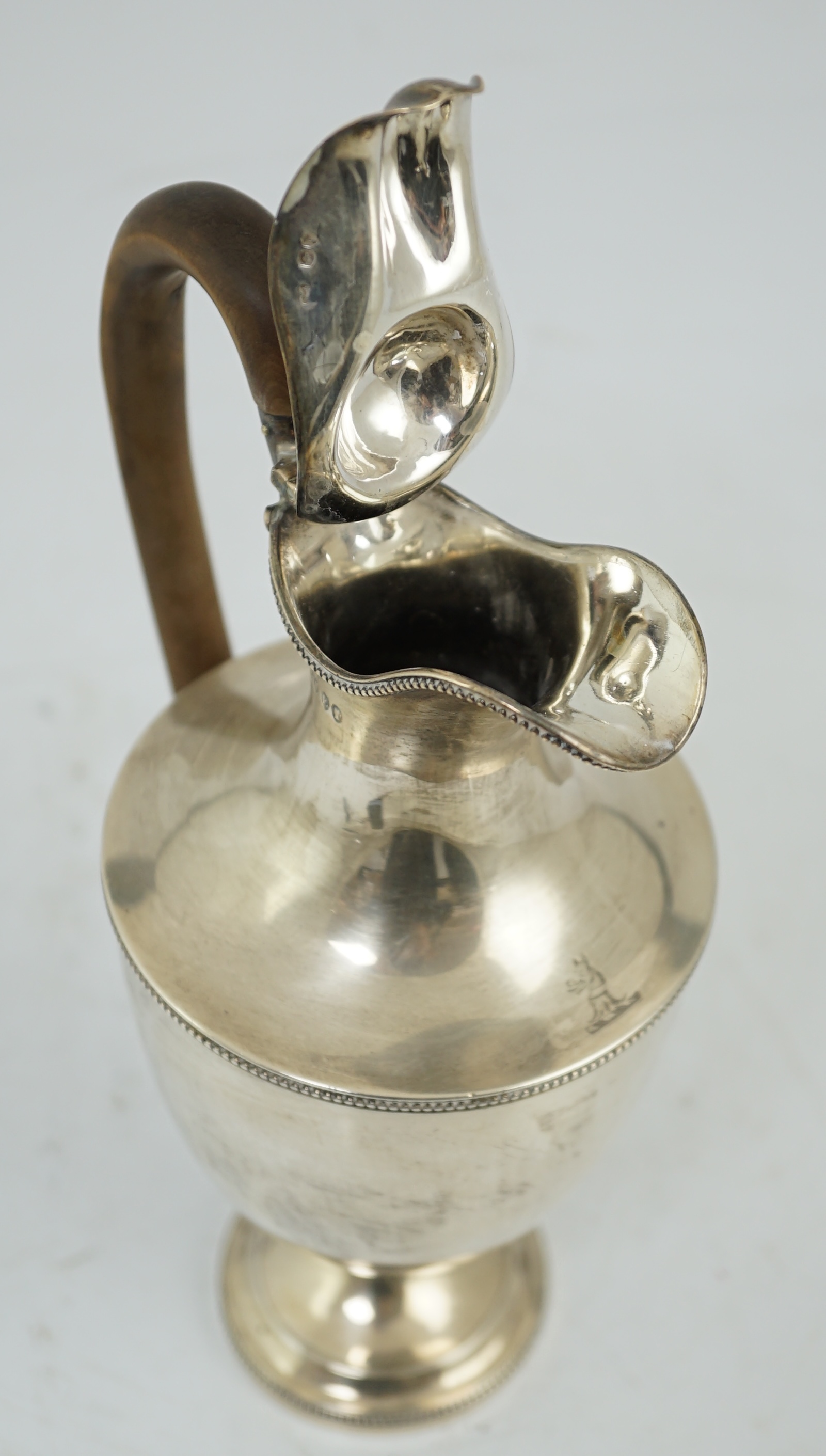 A late Victorian silver pedestal hot water jug, by Jackson & Chase